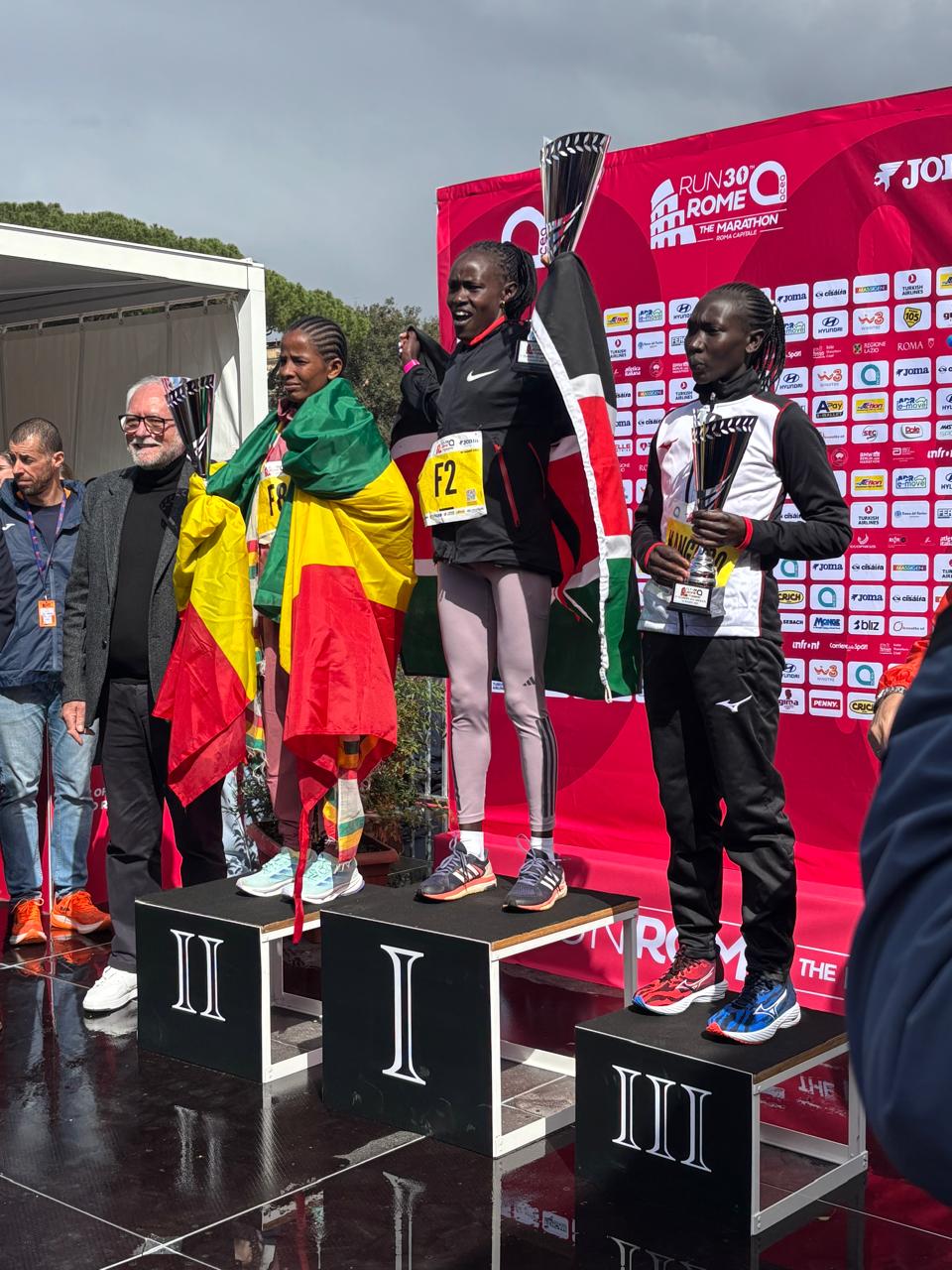 Betty Chepkwony and Rebecca Kangogo at the podium after winning during the 30th edition of the Rome Marathon. 