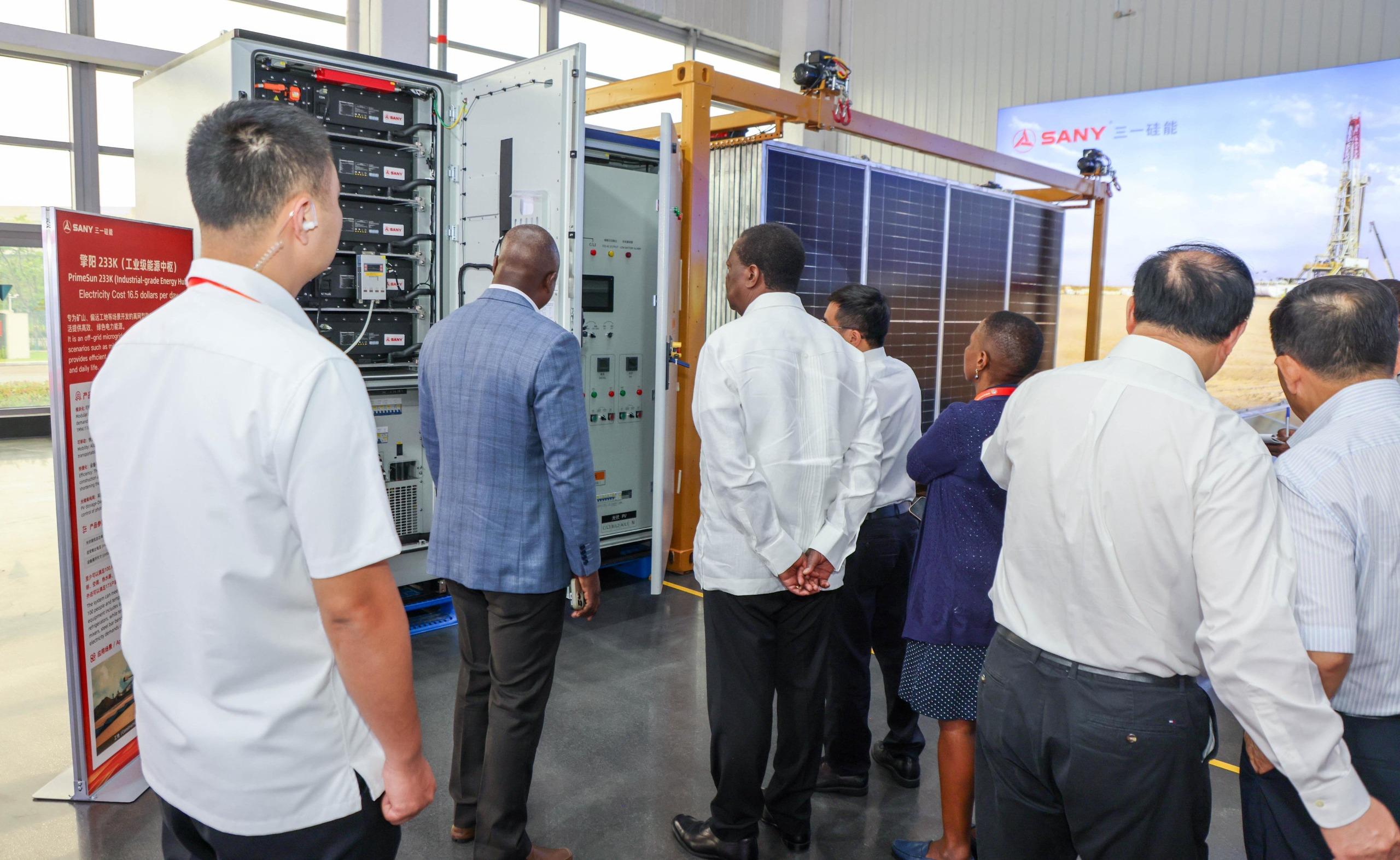 PCS Mudavadi on a tour with with executives from SANY Silicon Energy