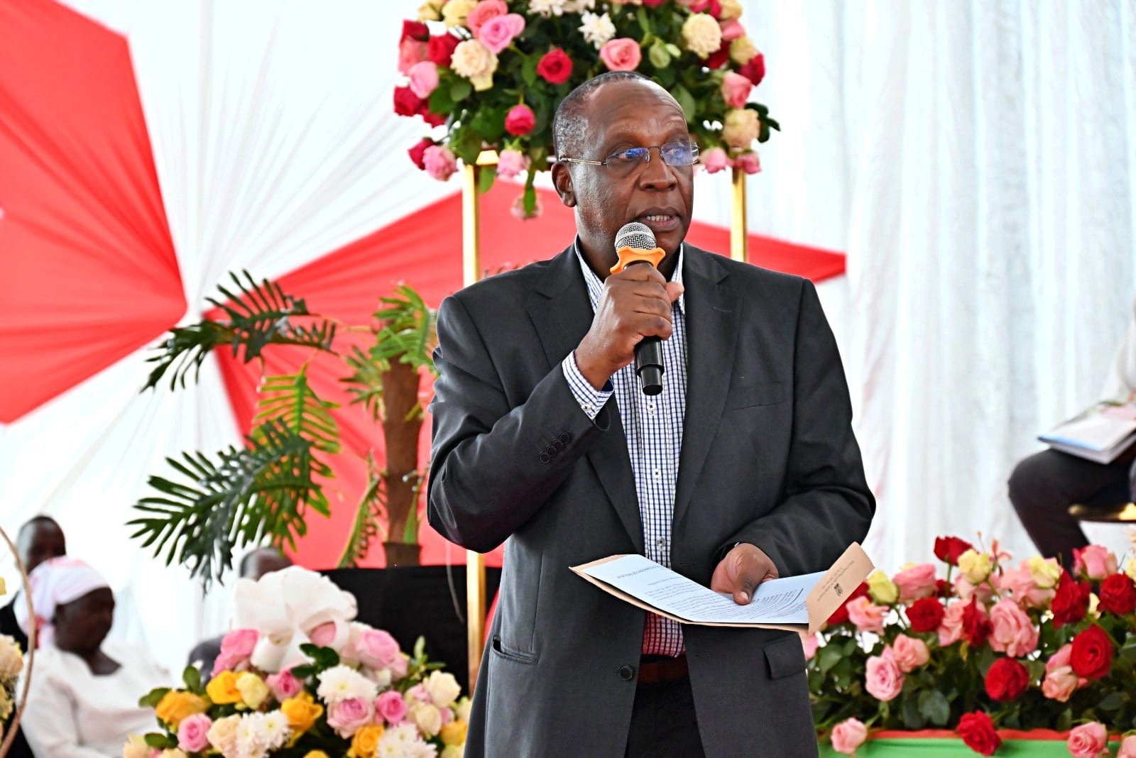 Ambassador Patrick Wamoto, MBS – Ag. Director General of the Foreign Service Academy reads a tribute on behalf of Dr. Korir SingOei, Principal Secretary for the State Department for Foreign Affairs during Ambassador Boaz Kidiga Mbaya, CBS, MBS funeral at Vihiga