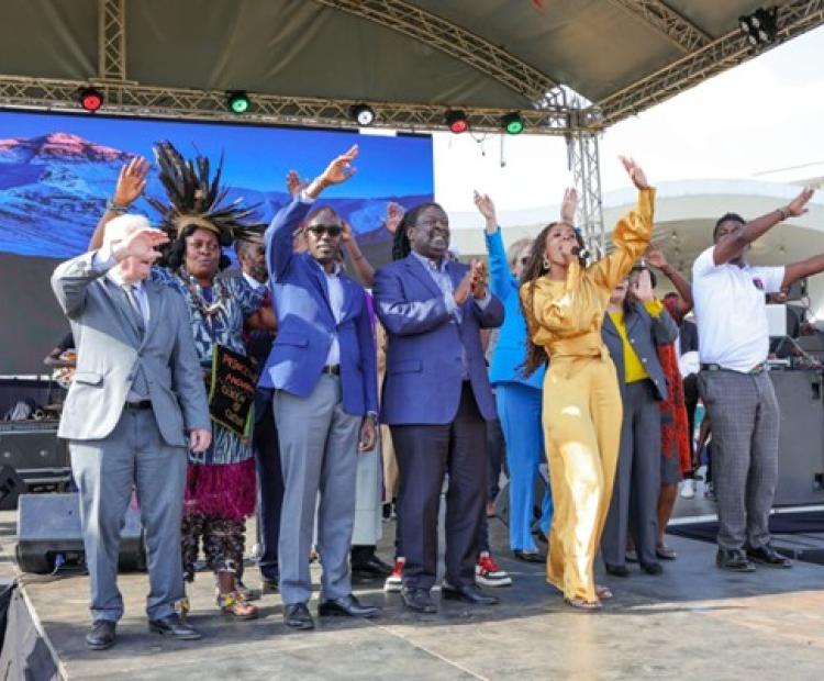 Prime Cabinet Secretary Dr. Musalia Mudavadi and PS Korir Sing’oei join artists on stage during the Harmony 4Haiti Concert and Cultural Festivals in August 2024.