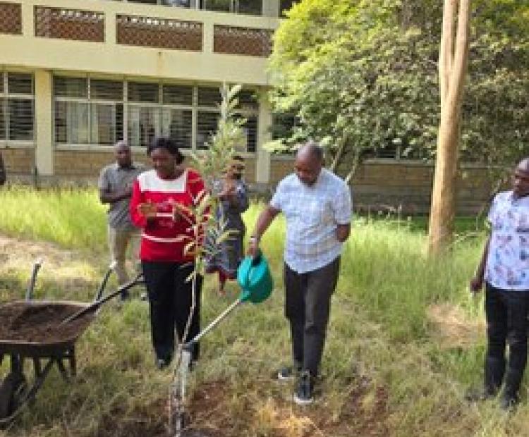 Amb. Kiboino and Director PS Office, leads the PC team in planting trees at the KEFRI Kitui offices